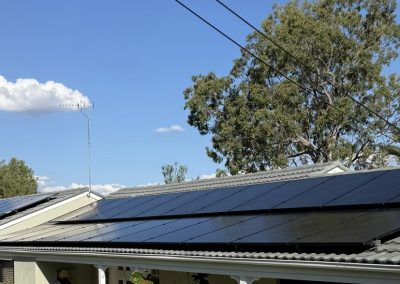 Residential rooftop solar array above a pool