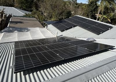Solar panels installed across two roof faces on a Queensland home