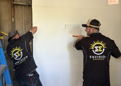 Electricians running conduit on a residential fit-out