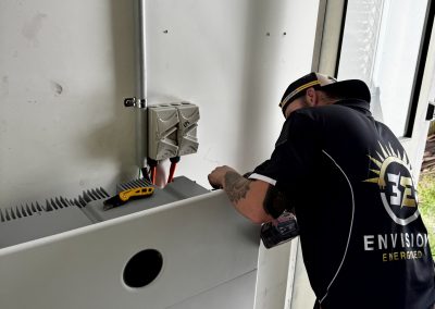 Electrician commissioning a home battery